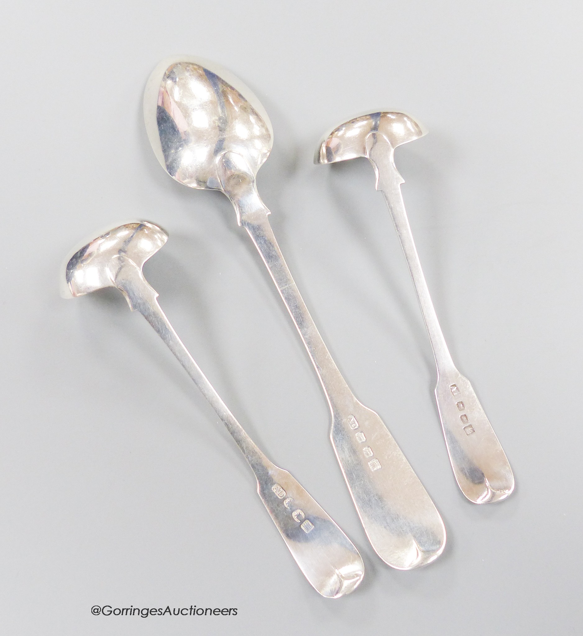 A 19th century Scottish provincial fiddle pattern table spoon, 22.3cm and two similar toddy ladles, Andrew Davidson, Arbroath, c.1835, 123 grams.